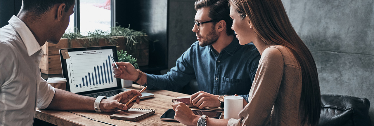 A couple at Tandia sitting with a Financial Expert