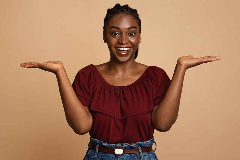 A woman smiling and making choices